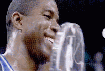 A Close Up Of A Man 'S Face With A Trophy On It GIF