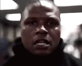A Close Up Of A Man 'S Face With A Very Angry Expression . GIF