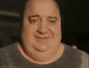 A Close Up Of A Man 'S Face With A Very Fat Neck And A Smile On His Face . GIF