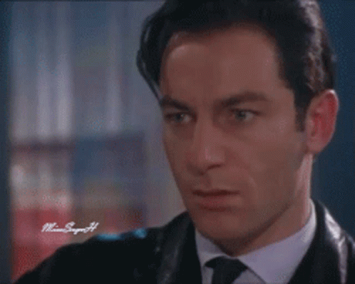 A Close Up Of A Man 'S Face With A Watermark That Says Miami Singer 44 GIF