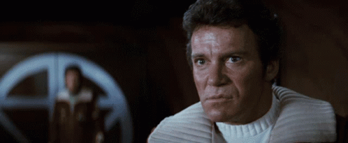 A Close Up Of A Man 'S Face With A White Collar GIF