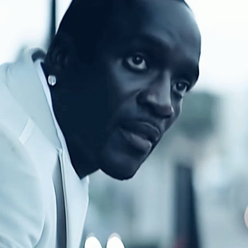 A Close Up Of A Man 'S Face With A White Shirt On GIF