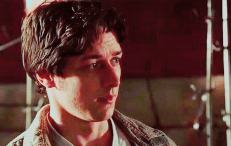 A Close Up Of A Man 'S Face With A White Shirt On GIF