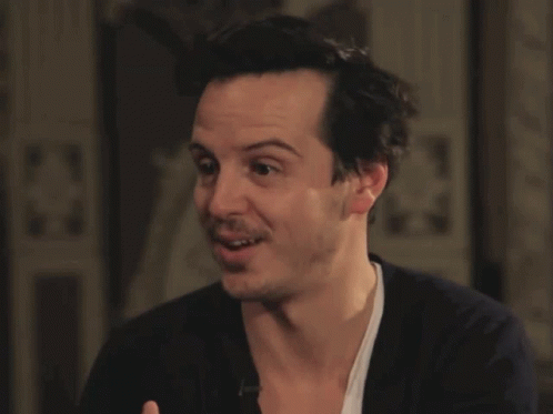 A Close Up Of A Man 'S Face With A White Shirt On GIF