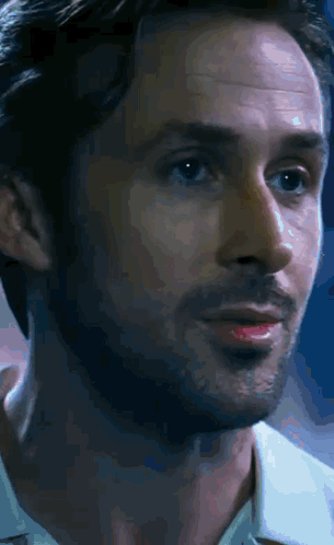 A Close Up Of A Man 'S Face With A White Shirt On GIF