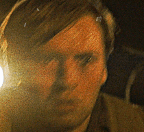A Close Up Of A Man 'S Face With A Yellow Background GIF