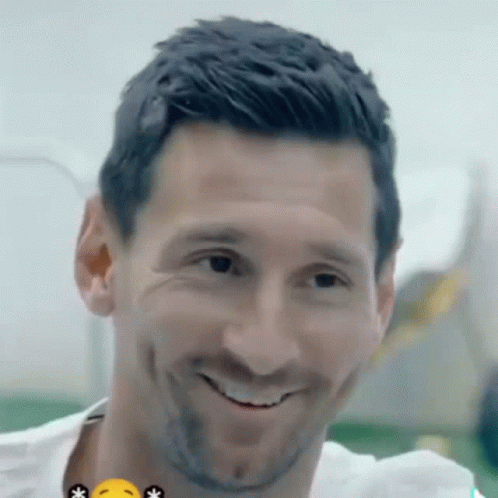 A Close Up Of A Man 'S Face With A Yellow Smiley Face GIF