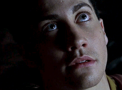A Close Up Of A Man 'S Face With A Yellow X In The Background GIF