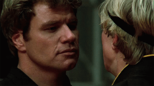 A Close Up Of A Man 'S Face With Another Man Behind Him GIF