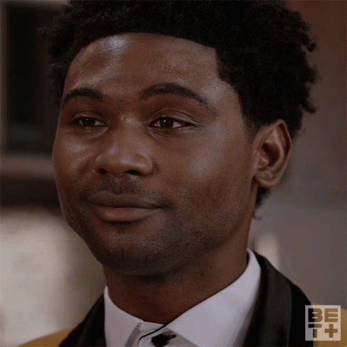 A Close Up Of A Man 'S Face With Be + Written On The Bottom GIF