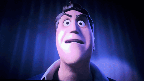 A Close Up Of A Man 'S Face With Big Eyes GIF