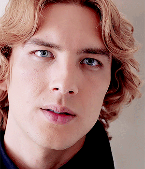 A Close Up Of A Man 'S Face With Blonde Hair GIF