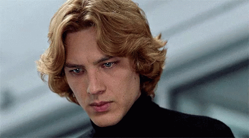 A Close Up Of A Man 'S Face With Blonde Hair And Blue Eyes GIF
