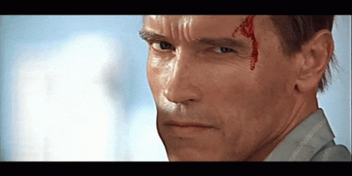A Close Up Of A Man 'S Face With Blood Coming Out Of His Forehead GIF