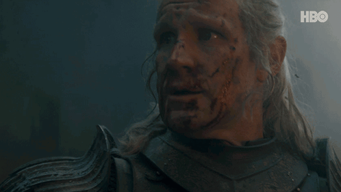 A Close Up Of A Man 'S Face With Blood Coming Out Of It . GIF