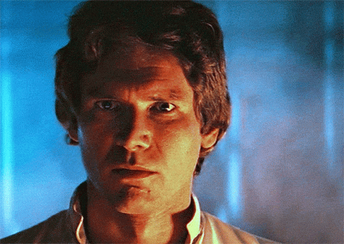 A Close Up Of A Man 'S Face With Blue Background GIF