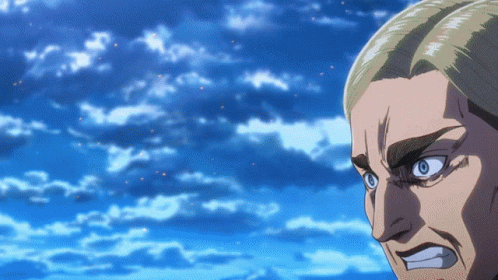 A Close Up Of A Man 'S Face With Blue Eyes Against A Blue Sky GIF