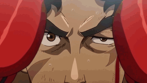 A Close Up Of A Man 'S Face With Boxing Gloves On GIF