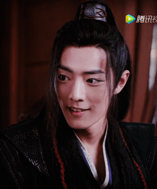 A Close Up Of A Man 'S Face With Chinese Writing On The Bottom Left GIF