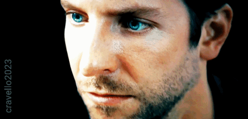 A Close Up Of A Man 'S Face With Crawling2023 On The Bottom Right GIF