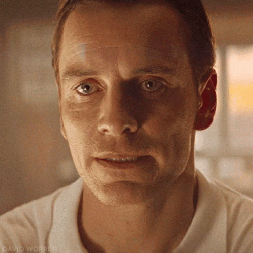 A Close Up Of A Man 'S Face With David Worren Written On The Bottom Right GIF
