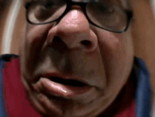 A Close Up Of A Man 'S Face With Glasses And A Fake Nose . GIF