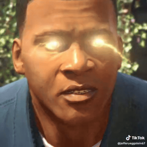 A Close Up Of A Man 'S Face With Glowing Eyes And A Blue Shirt . GIF