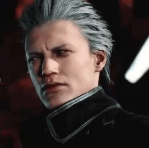 A Close Up Of A Man 'S Face With Gray Hair And A Black Jacket . GIF