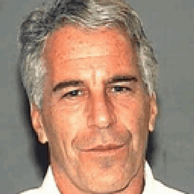 A Close Up Of A Man 'S Face With Gray Hair And A White Shirt GIF