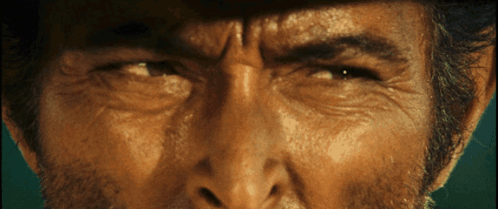 A Close Up Of A Man 'S Face With His Eyes Closed GIF