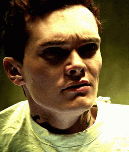 A Close Up Of A Man 'S Face With His Eyes Closed GIF