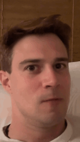A Close Up Of A Man 'S Face With His Eyes Closed . GIF