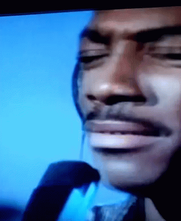 A Close Up Of A Man 'S Face With His Eyes Closed And A Mustache GIF