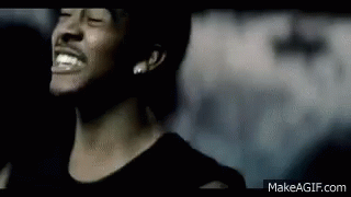 A Close Up Of A Man 'S Face With His Eyes Closed And A Smile On His Face . GIF