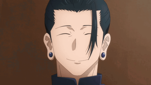A Close Up Of A Man 'S Face With His Eyes Closed And Blue Earrings GIF