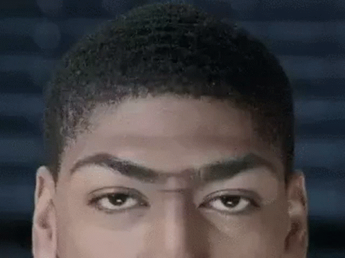 A Close Up Of A Man 'S Face With His Eyes Closed And His Hair Visible . GIF