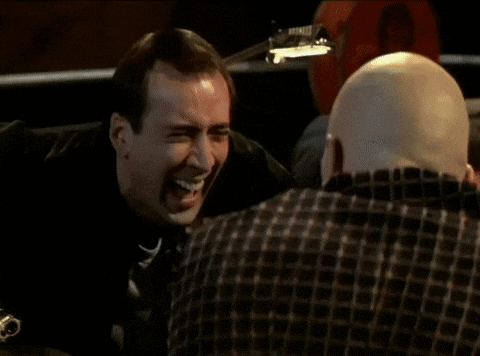 A Close Up Of A Man 'S Face With His Eyes Closed And His Hand On His Forehead GIF
