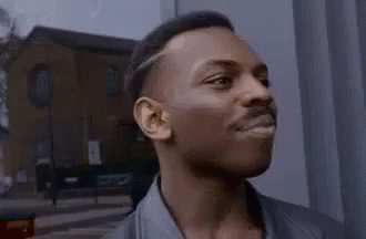 A Close Up Of A Man 'S Face With His Eyes Closed And His Mouth Open . GIF