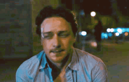 A Close Up Of A Man 'S Face With His Eyes Closed And His Mouth Open GIF