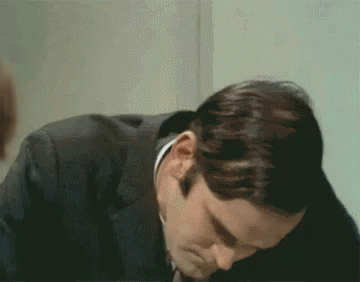 A Close Up Of A Man 'S Face With His Eyes Closed GIF