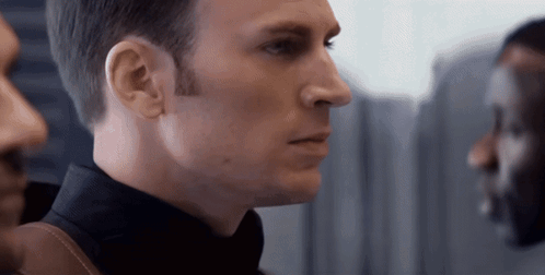 A Close Up Of A Man 'S Face With His Eyes Closed GIF