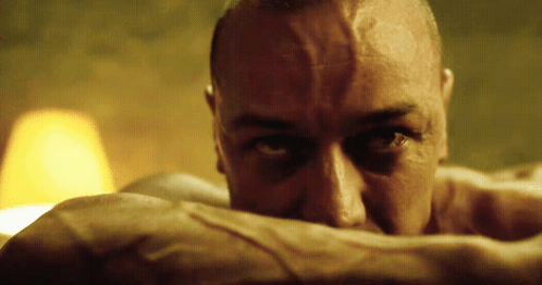 A Close Up Of A Man 'S Face With His Eyes Closed GIF