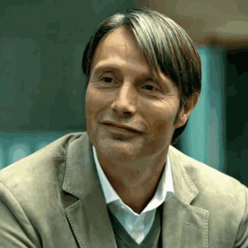 A Close Up Of A Man 'S Face With His Eyes Closed GIF