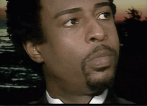 A Close Up Of A Man 'S Face With His Eyes Closed GIF