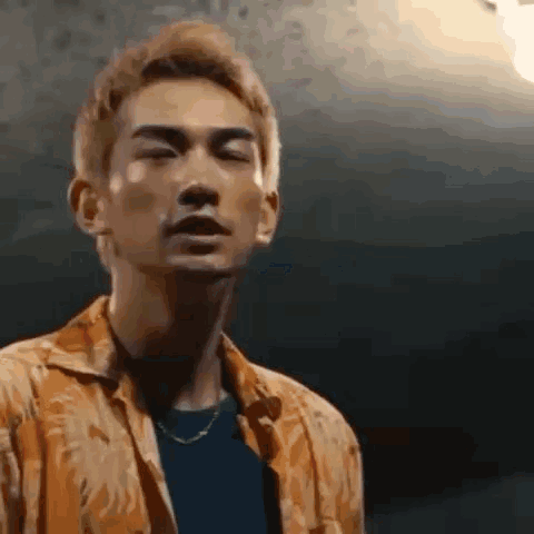 A Close Up Of A Man 'S Face With His Eyes Closed . GIF