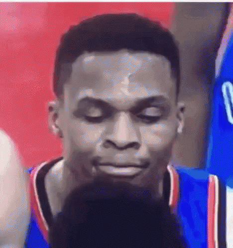 A Close Up Of A Man 'S Face With His Eyes Closed . GIF
