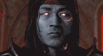 A Close Up Of A Man 'S Face With His Eyes Glowing GIF