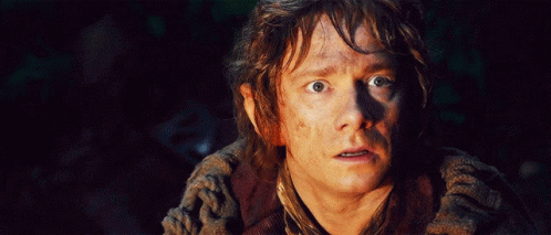 A Close Up Of A Man 'S Face With His Eyes Wide Open GIF