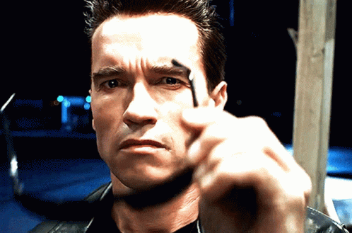 A Close Up Of A Man 'S Face With His Finger Pointing GIF