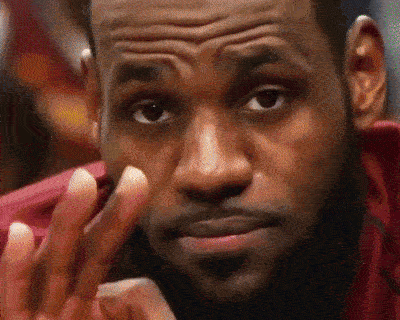 A Close Up Of A Man 'S Face With His Hand On His Chin GIF